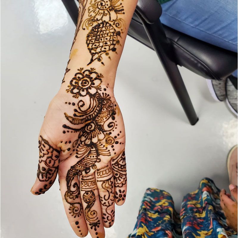 Henna (mehndi) design covering a hand and forearm