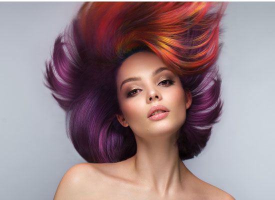 Hair colored in vivid purple and red tones